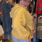 Chaqueta elegante con cremallera y capucha con volante en el bajo